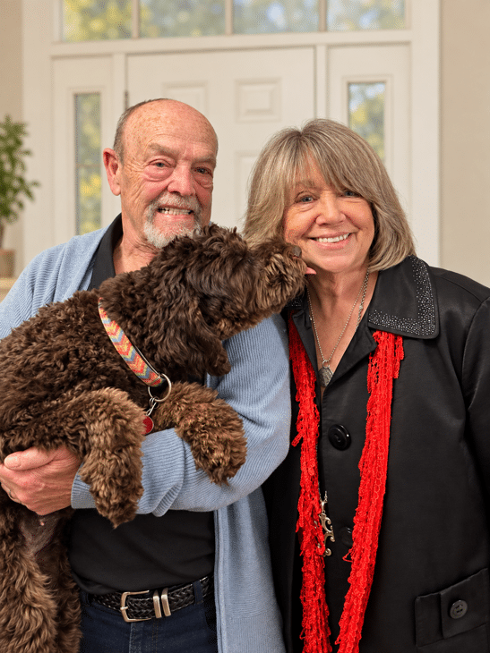 Linda and Sonny of Agape Labradoodles with Poppy